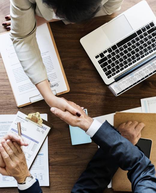 Business people shaking hands together